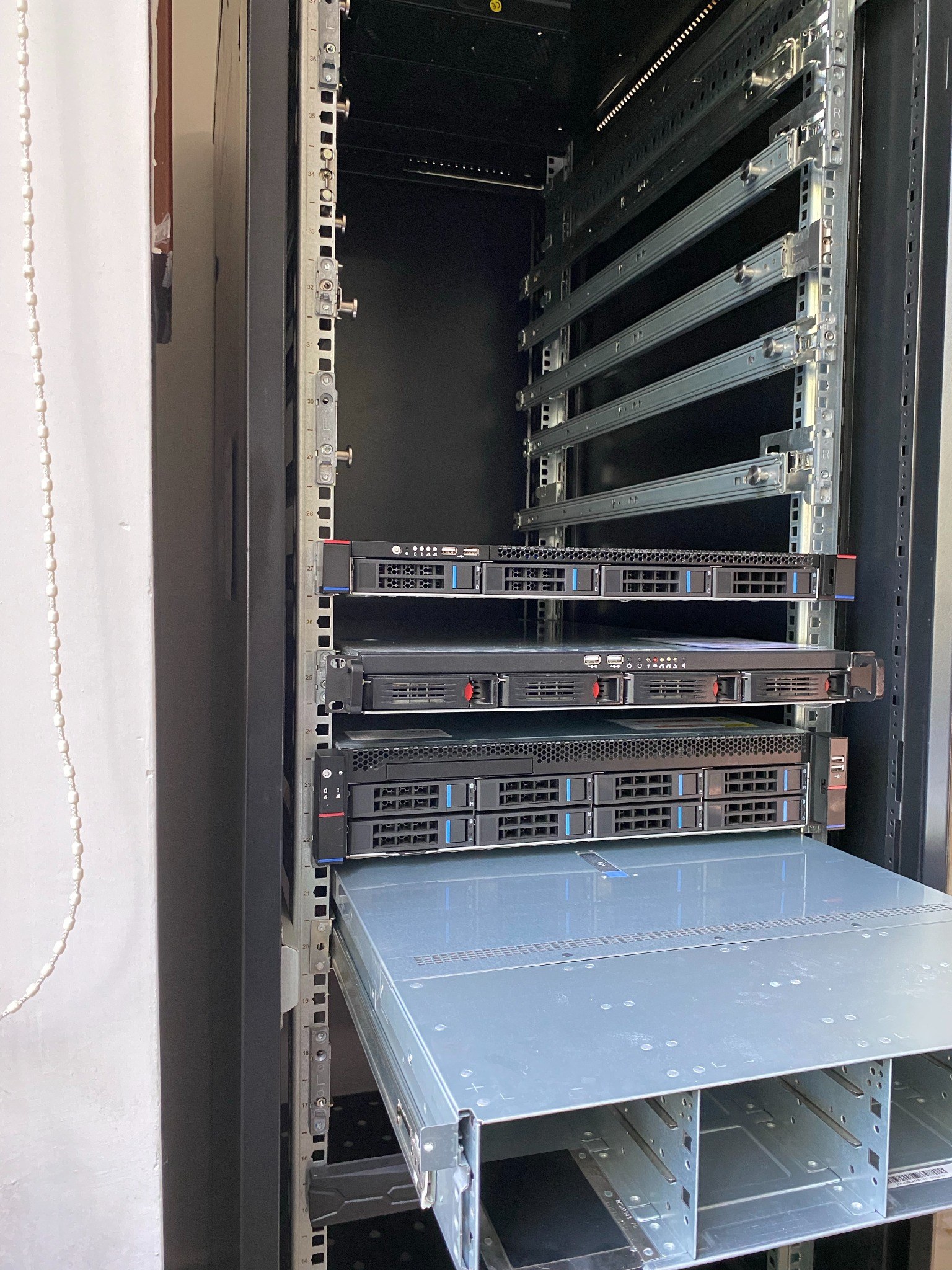 Server rails deployed in 19-inch racks
